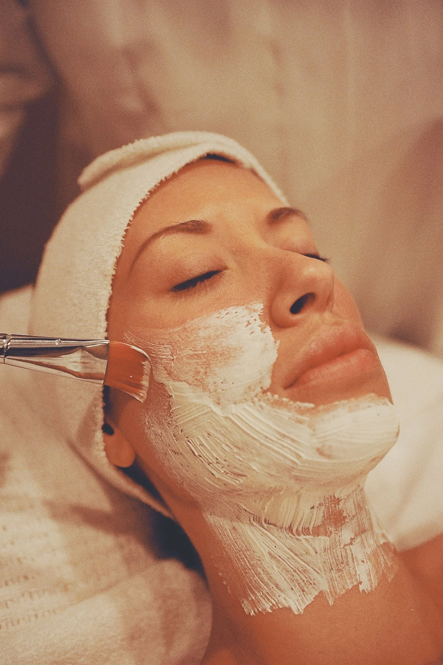 Stock photograph of a signature facial with a purifying masque application