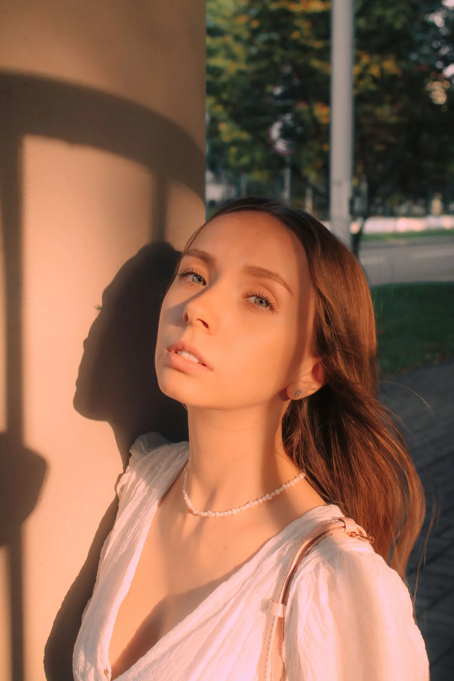 Portrait of a woman in warm golden light at THEIA